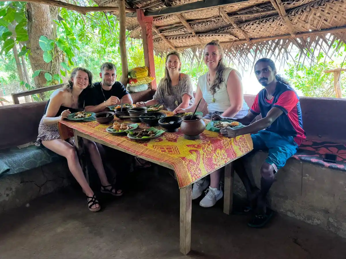 Travellers enjoying traditional Sri Lankan food